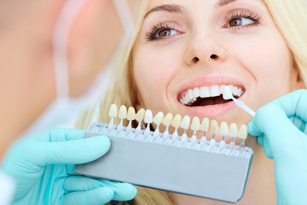 Visit-your-dentist-Newport-Beach-to-get-the-best-advice-about-veneers-and-crowns